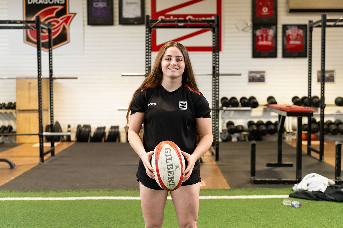 Lily holding Rugby ball - IWD